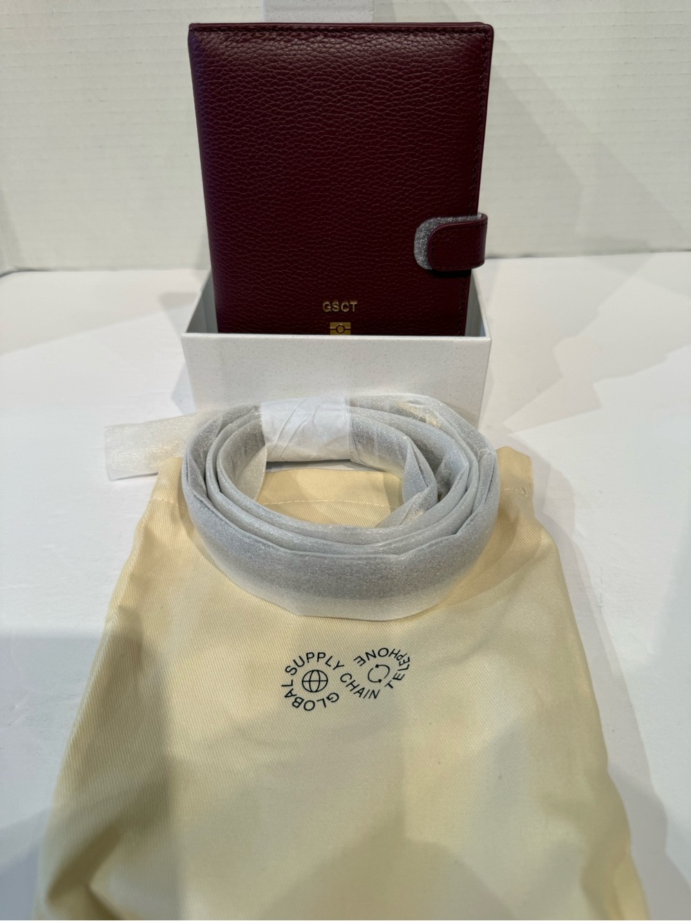 Brand new MSCHF Burgundy Leather Passport/Wallet with Snap Closure and strap